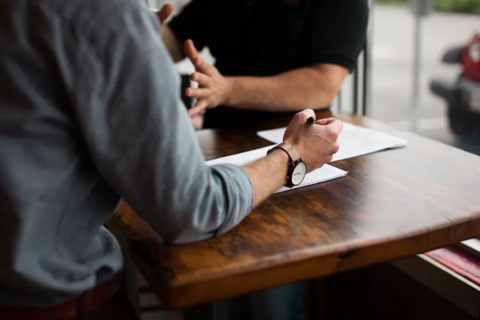 Leaders working together around a table